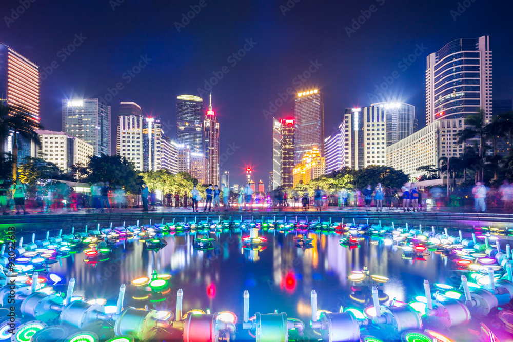 modern square and skyscrapers at night