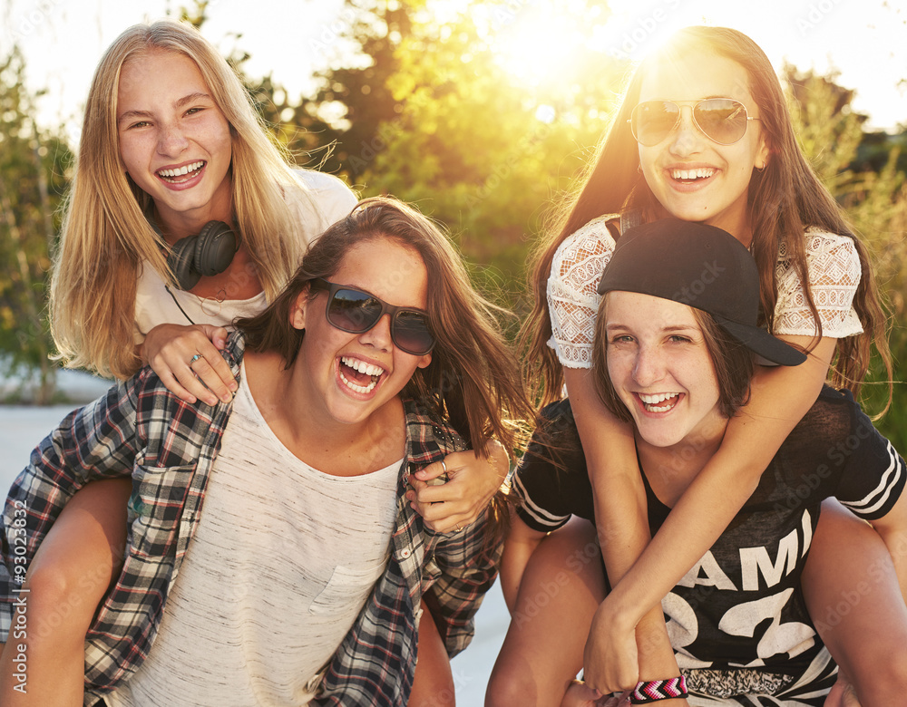 Teenage girls laughing