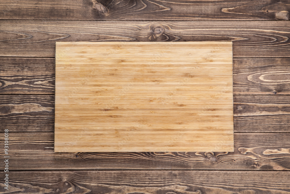 top view of wooden cutting board on old wooden table