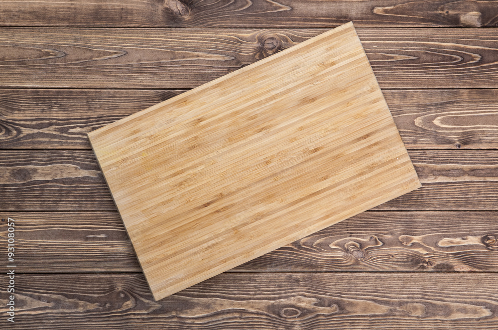 cutting board on wooden table. top view