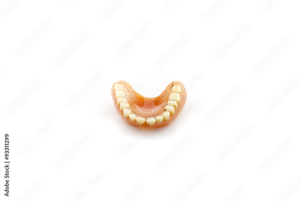 Old dentures isolated on white background.