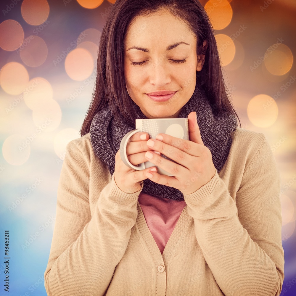 Composite image of smiling woman smelling hot beverage