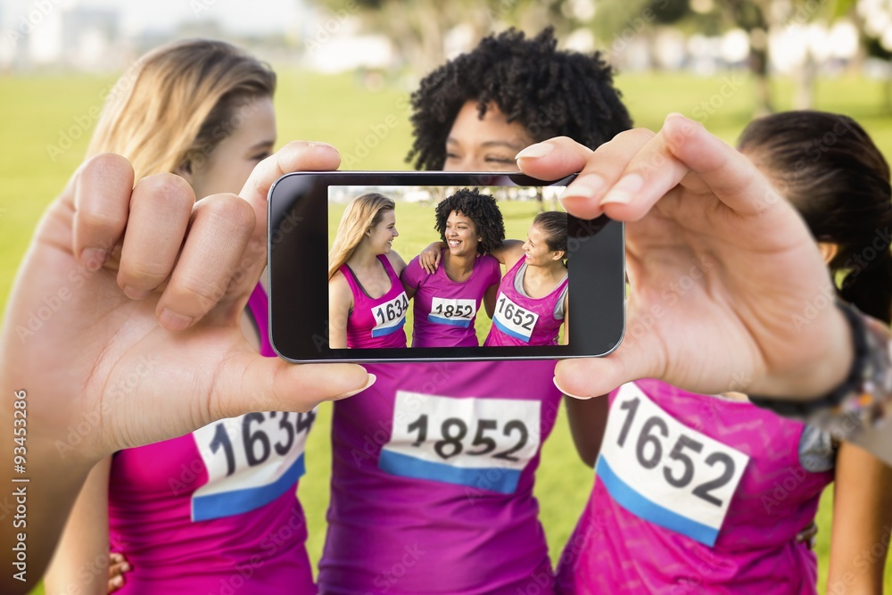 Composite image of hand holding smartphone showing