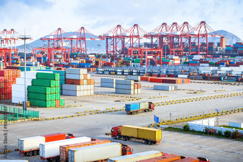 busy harbour with full loads of containers