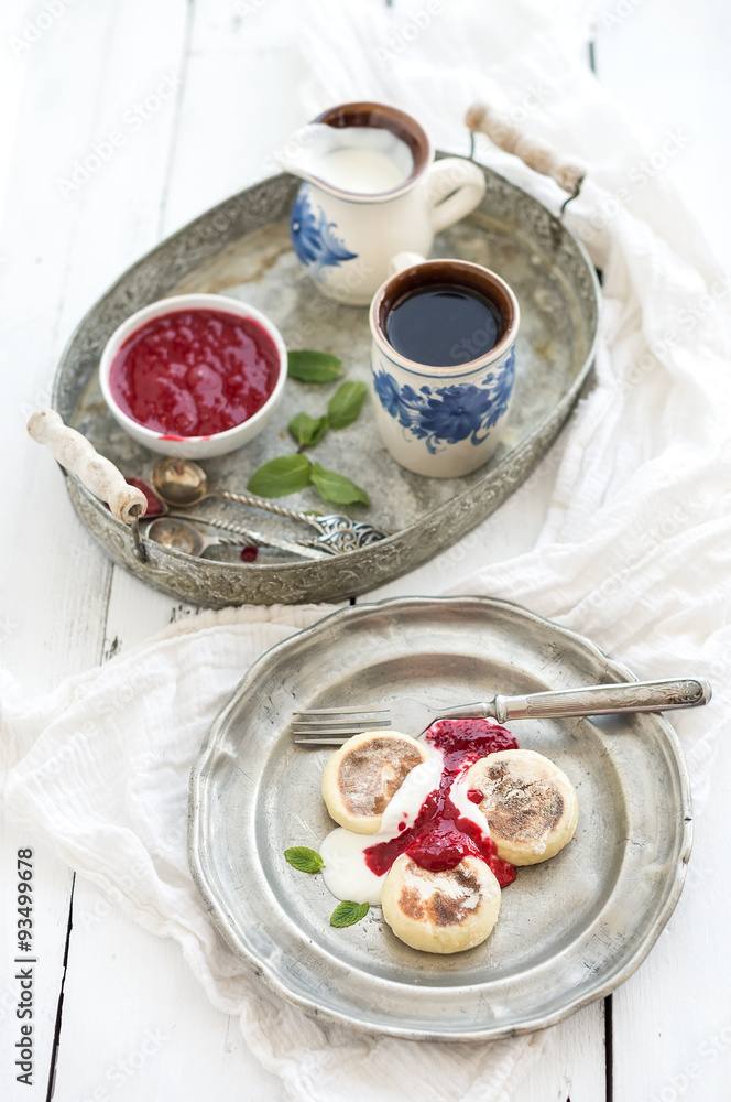 Breakfast set. Russian cottage cheese pancakes or syrniki on a