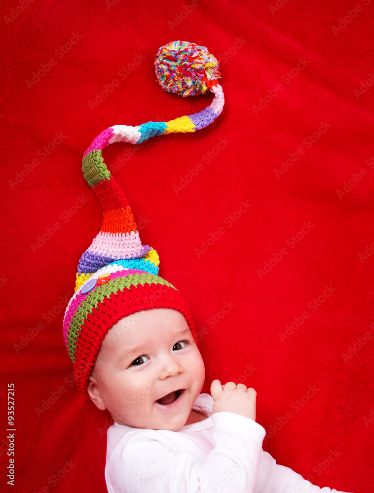 Baby in red and white hat