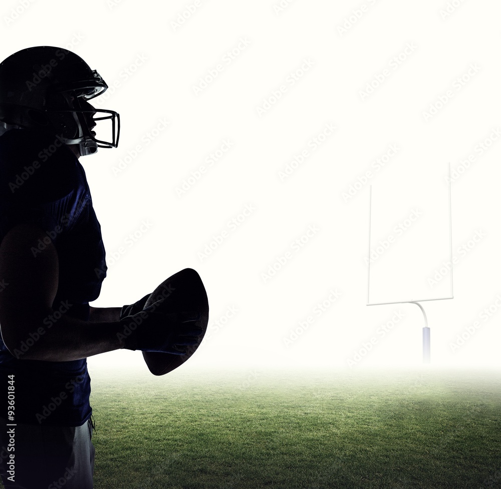 Composite image of side view of sportsman holding football