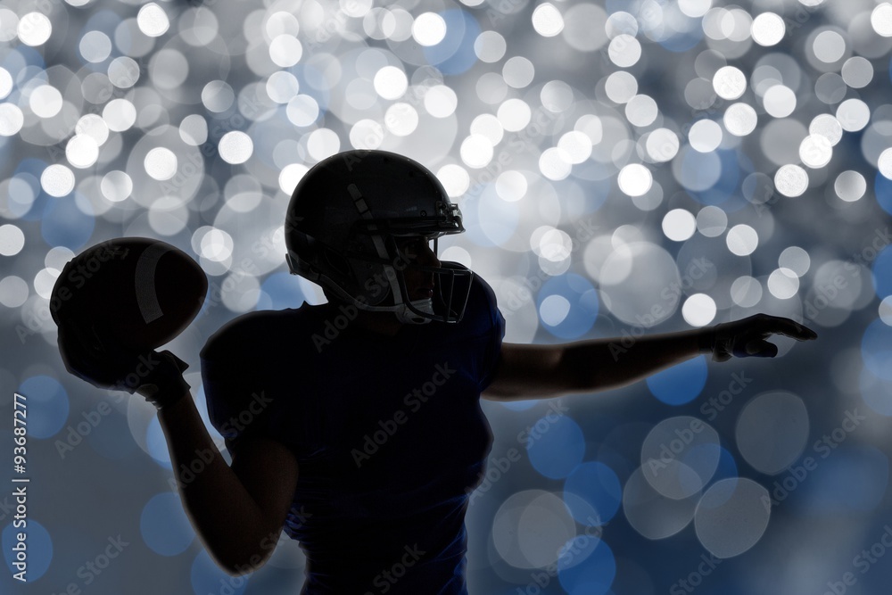 Composite image of silhouette american football player 