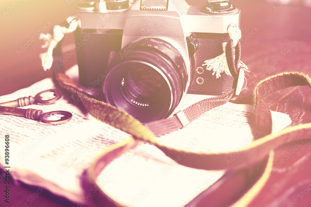 Old photo camera, book and keys