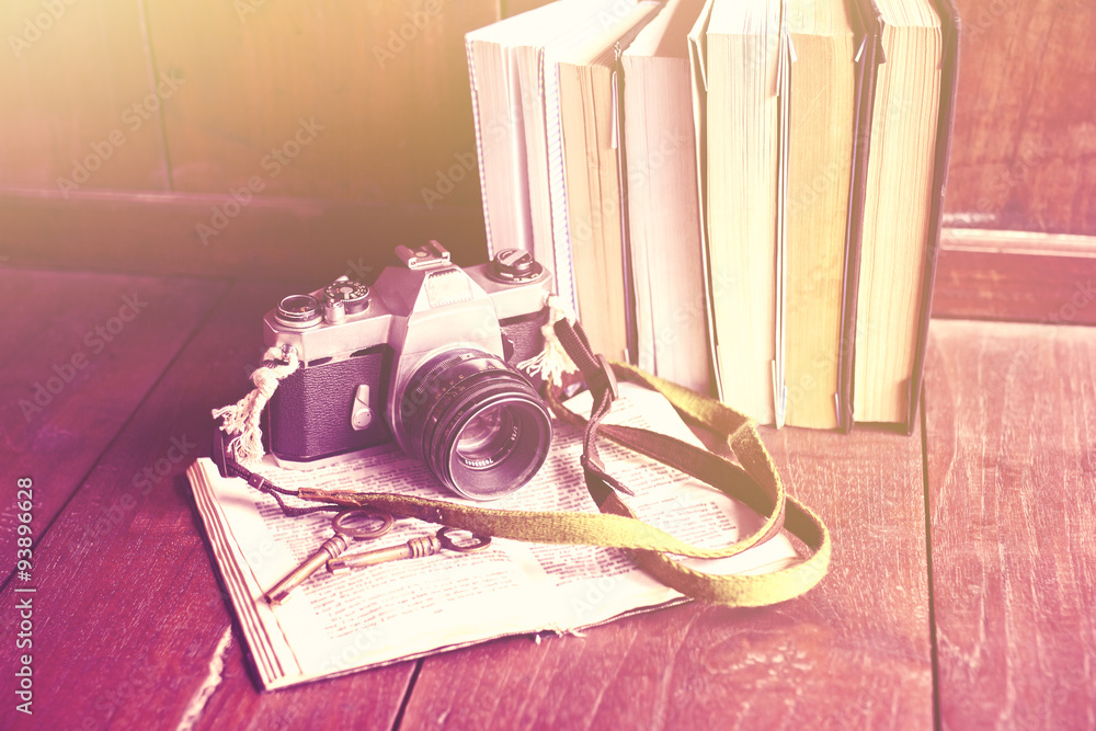 Old photo camera, books and keys