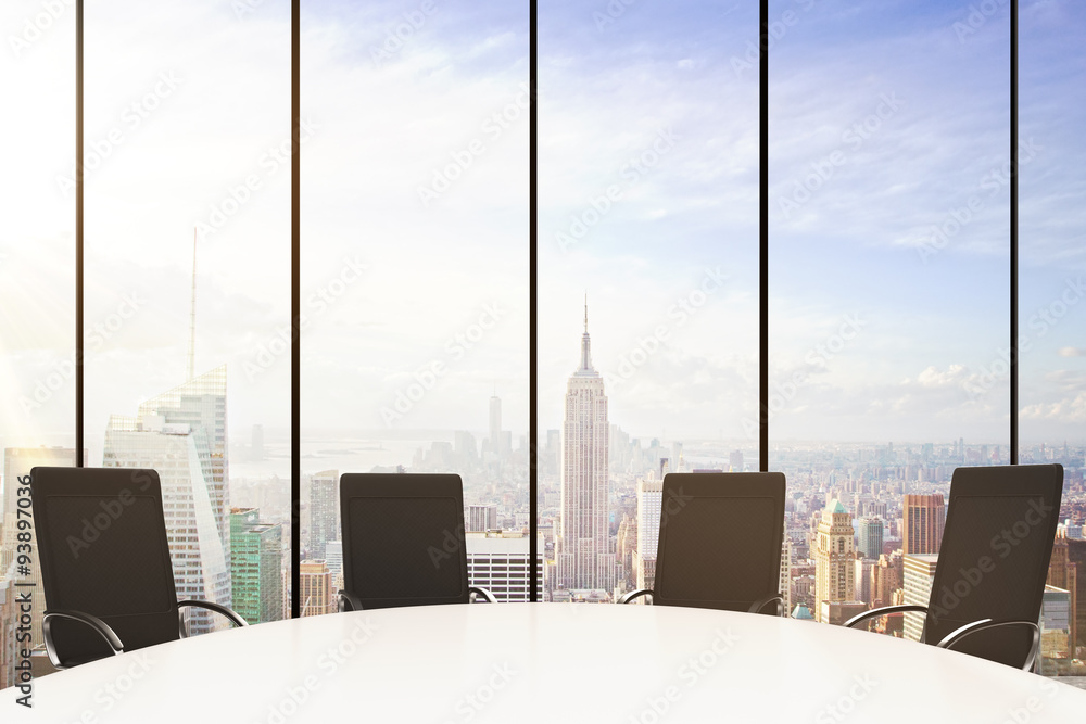 White round conference table with chairs, windows in floor and c