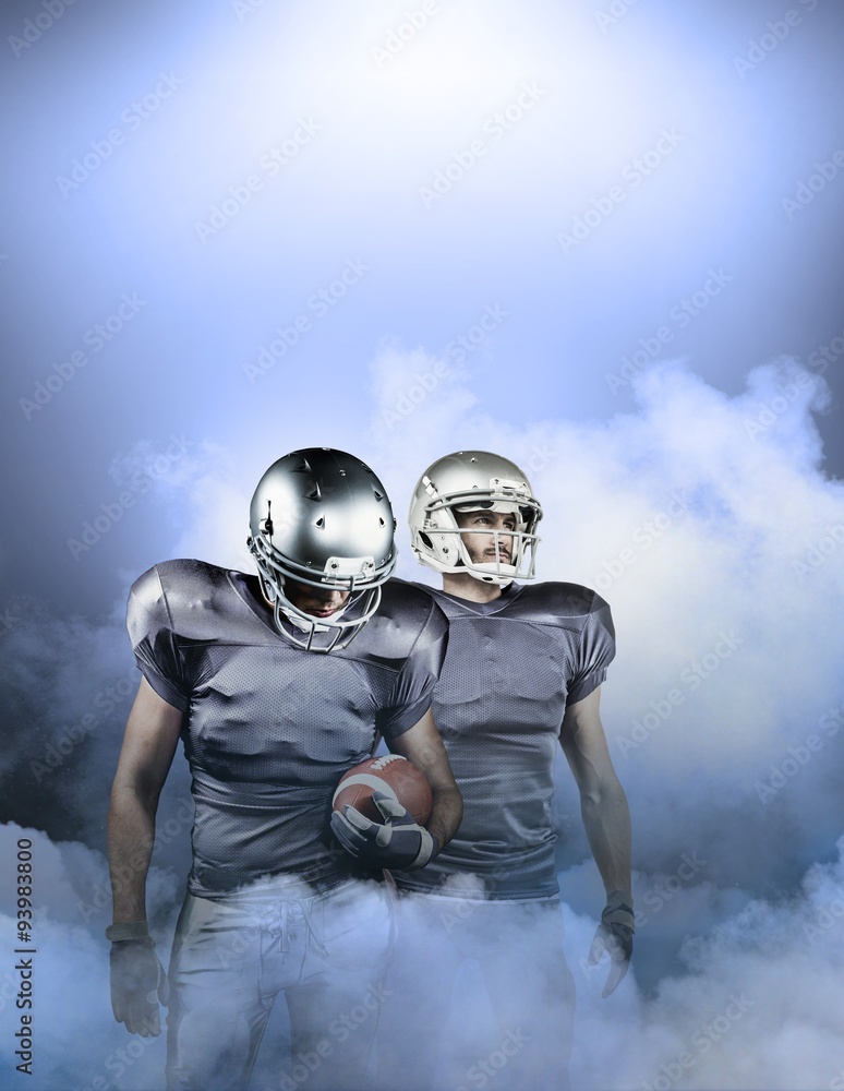 Composite image of american football player looking down