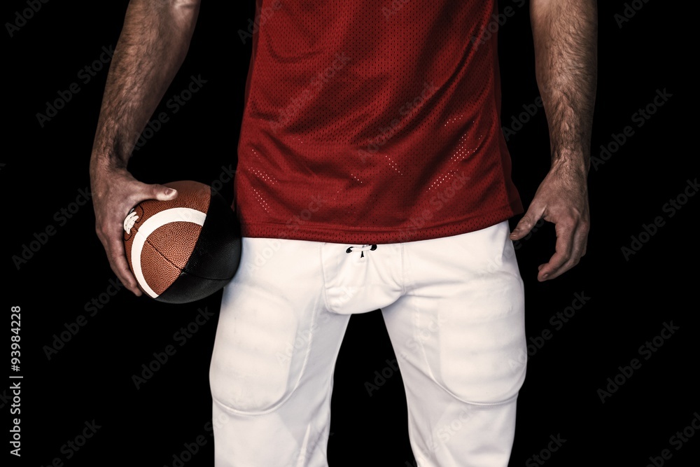 Composite image of midsection of a rugby player holding ball