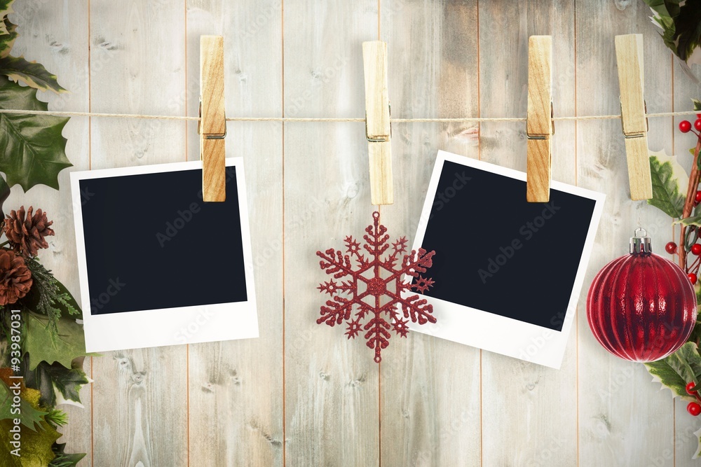 Composite image of hanging christmas photos