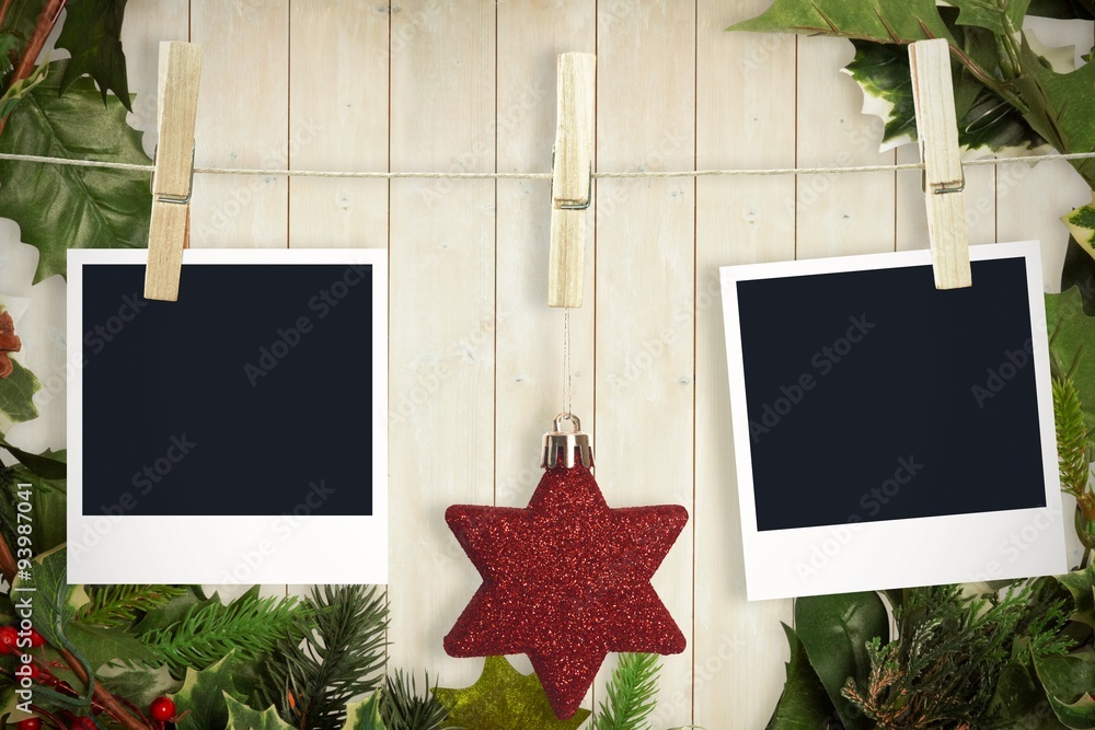 Composite image of hanging christmas photos