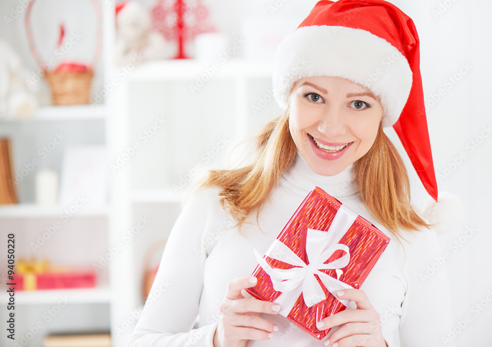 happy woman with Christma gift at home