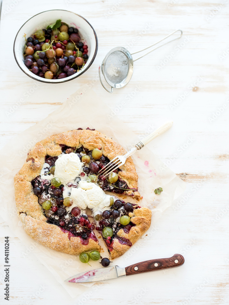 Summer crostata or galette pie with fresh garden berries and