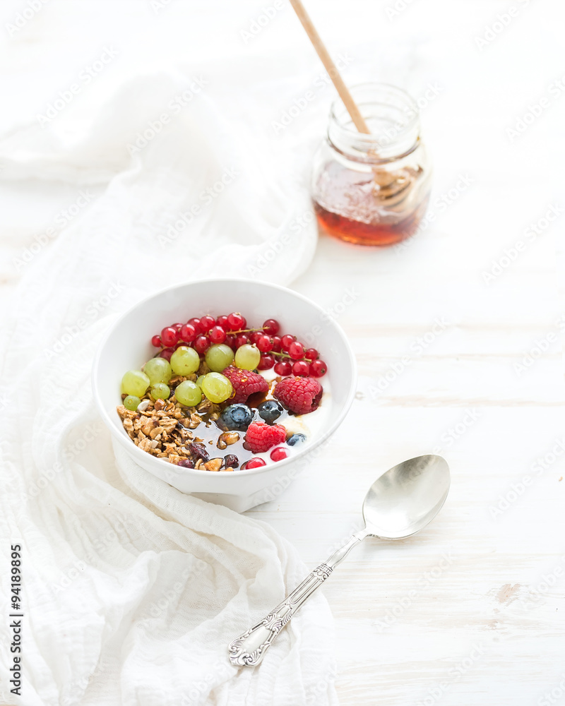 Healthy breakfast. Bowl of oat granola with yogurt, fresh