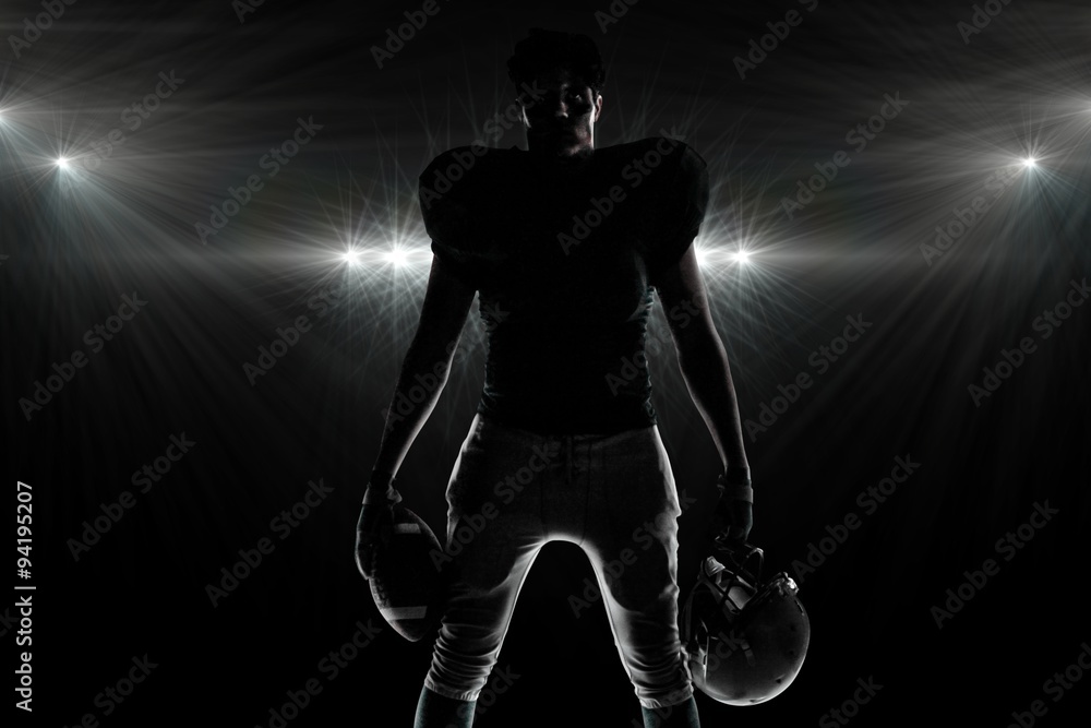 Composite image of silhouette american football player