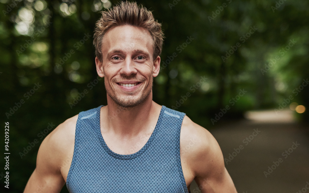 Smiling handsome muscular young man