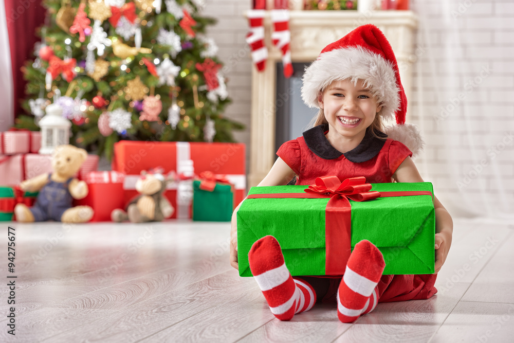 girl holding Christmas gift