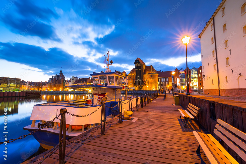 Old town of Gdansk with ancient crane at dusk, Poland