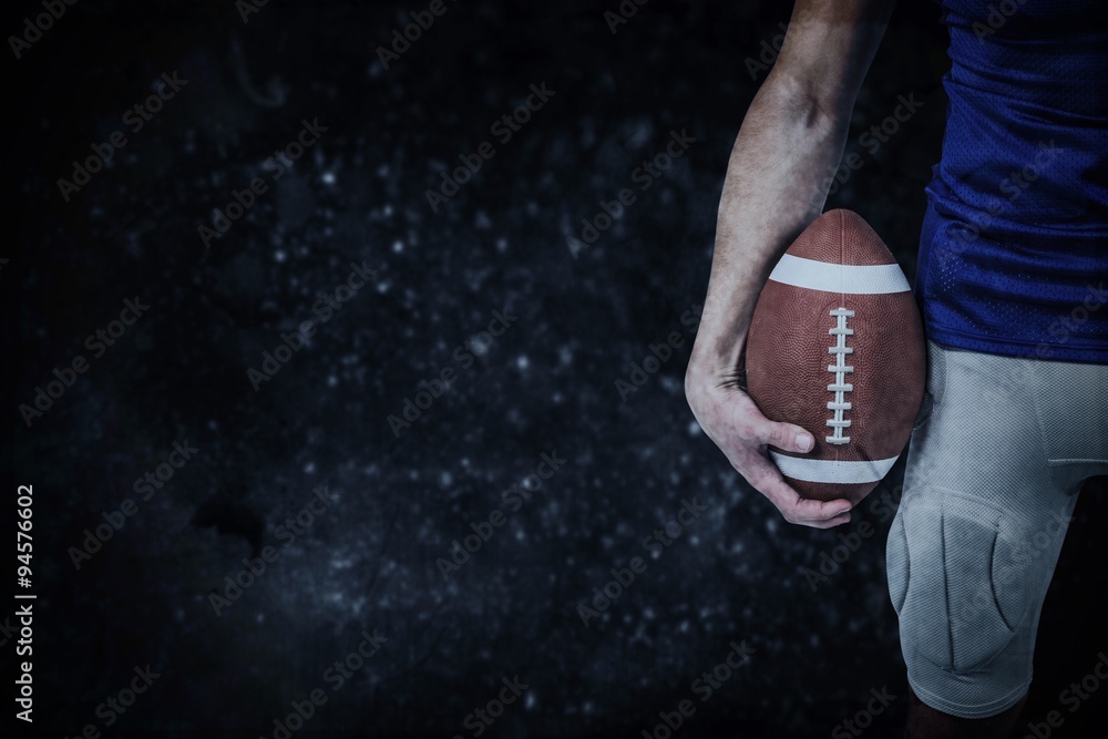 Composite image of sports player holding ball