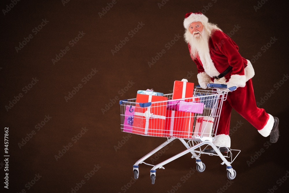 Composite image of santa rides on a shopping cart