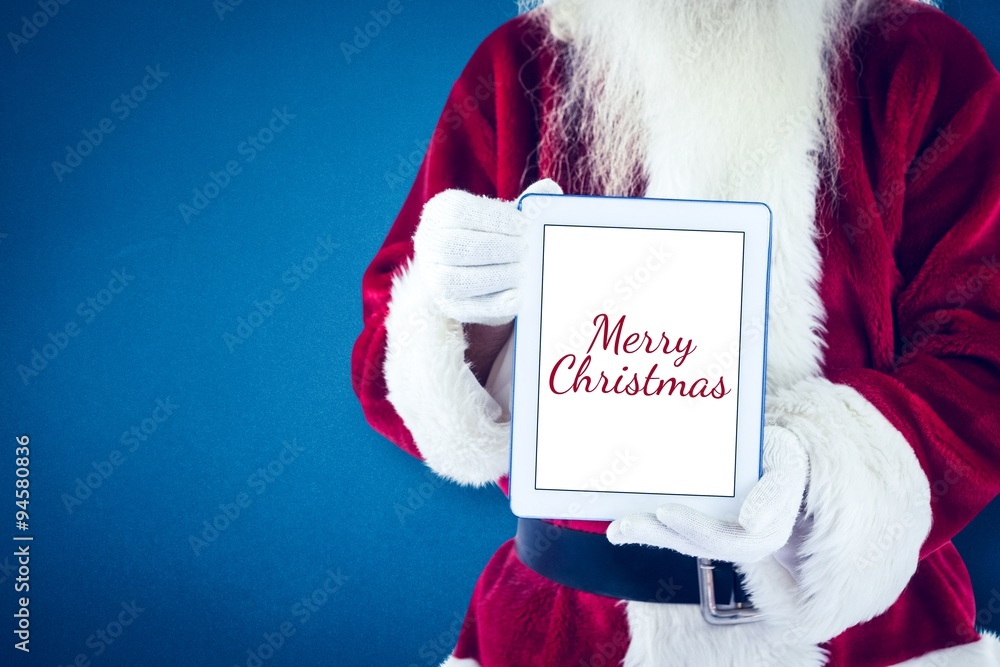 Composite image of santa presents a tablet pc