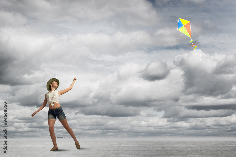 Girl and flying kite