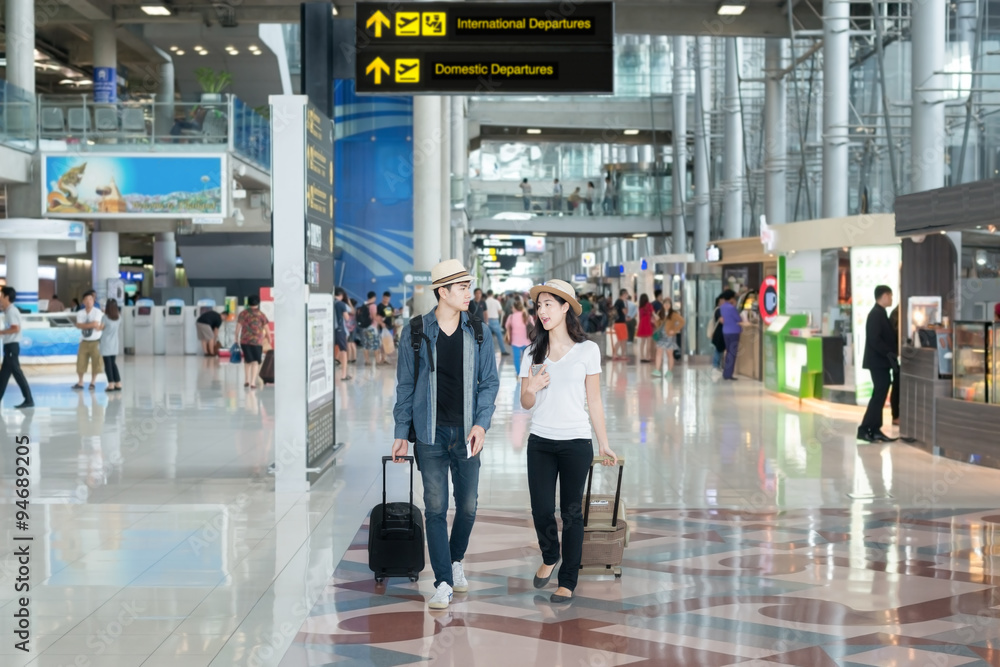 Asian couple tourist at the international airport.