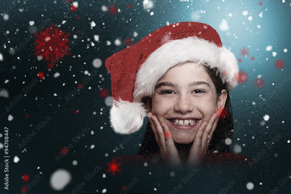 Composite image of festive little girl smiling at camera