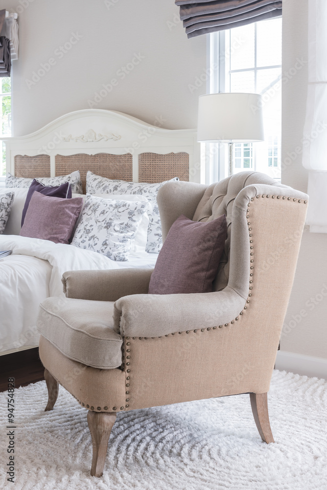 classic chair on carpet with pillow