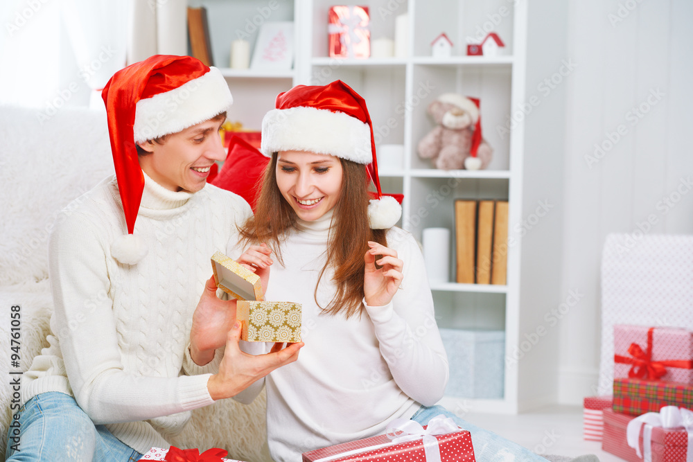 Christmas gift. man gives a woman gift present box