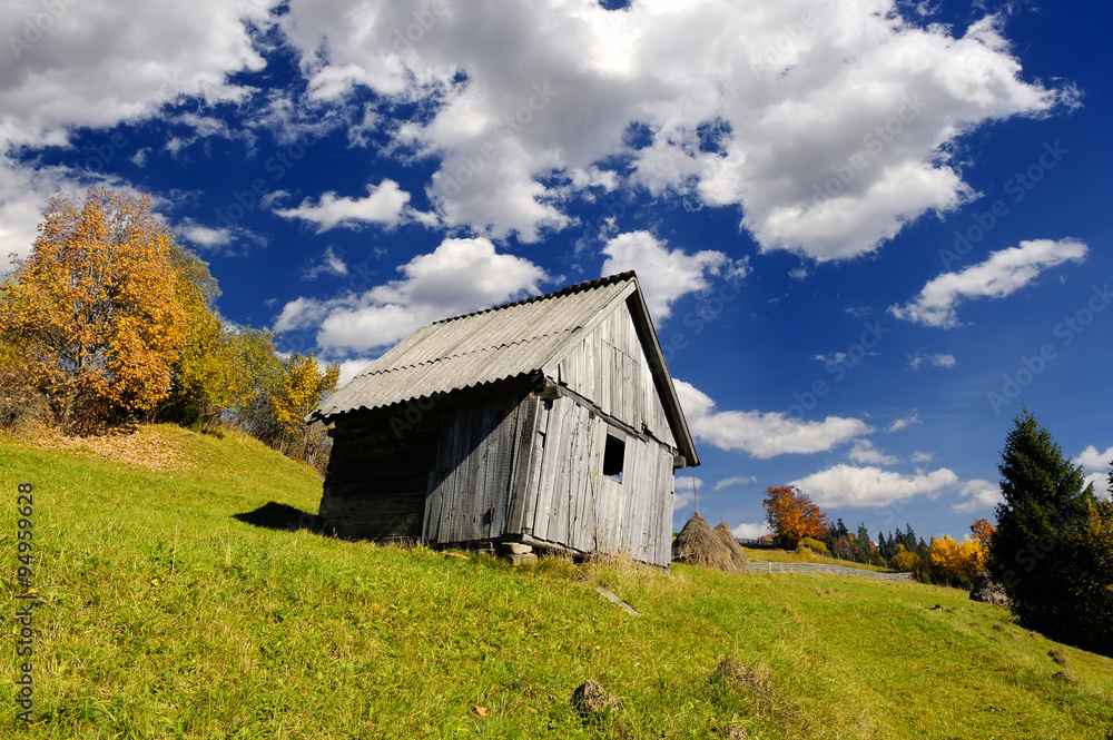 Alone house in autumn mountain