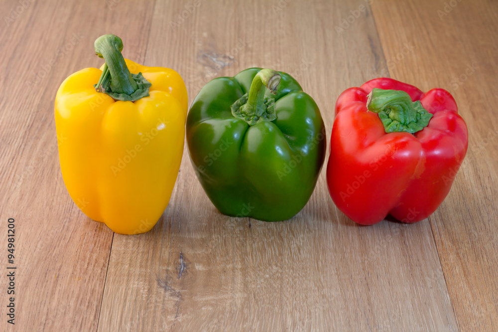 Three colorful sweet peppers