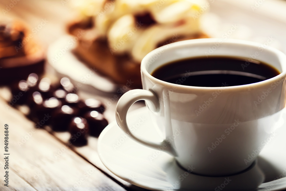 Cup of coffee with assorted desserts