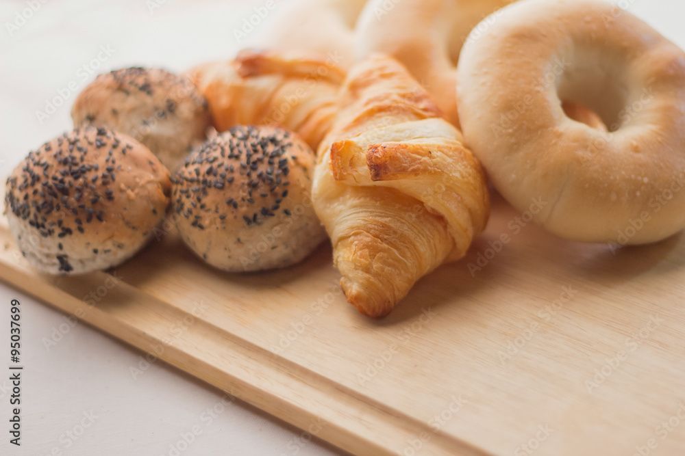 fresh bread  on the wooden board and white background