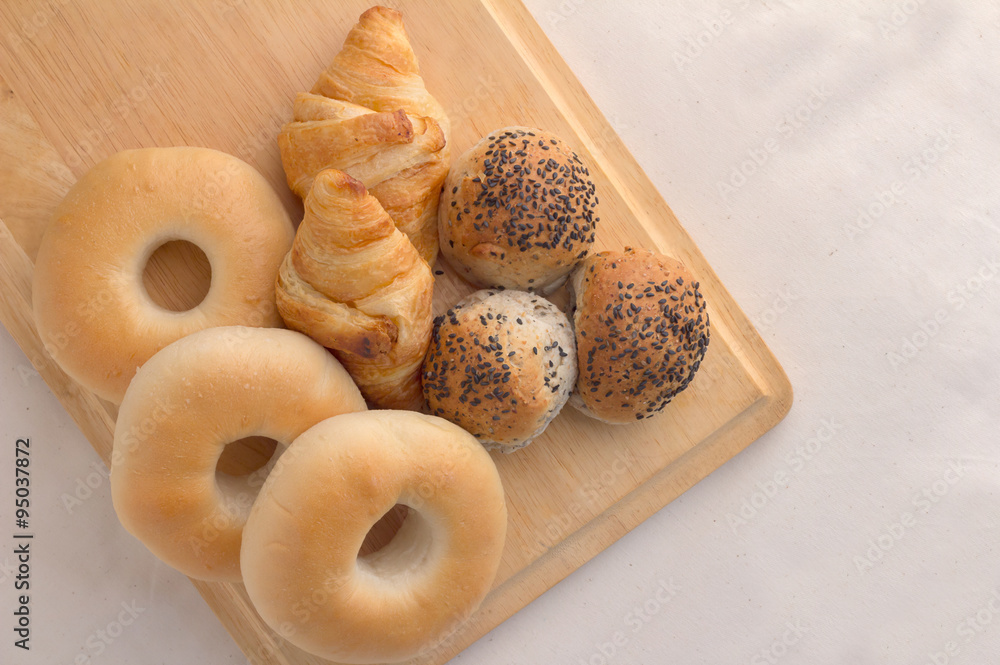 mix bread on wood board with fabric background.jpg