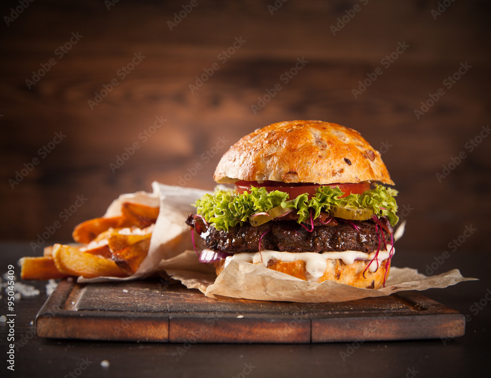 Delicious hamburger on wood