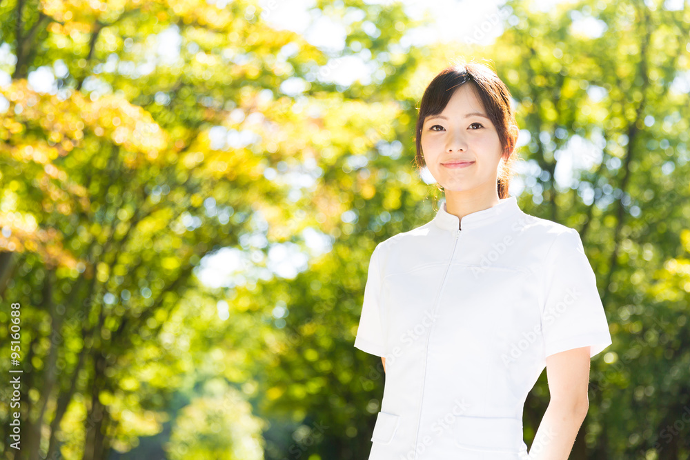 young asian nurse in the park