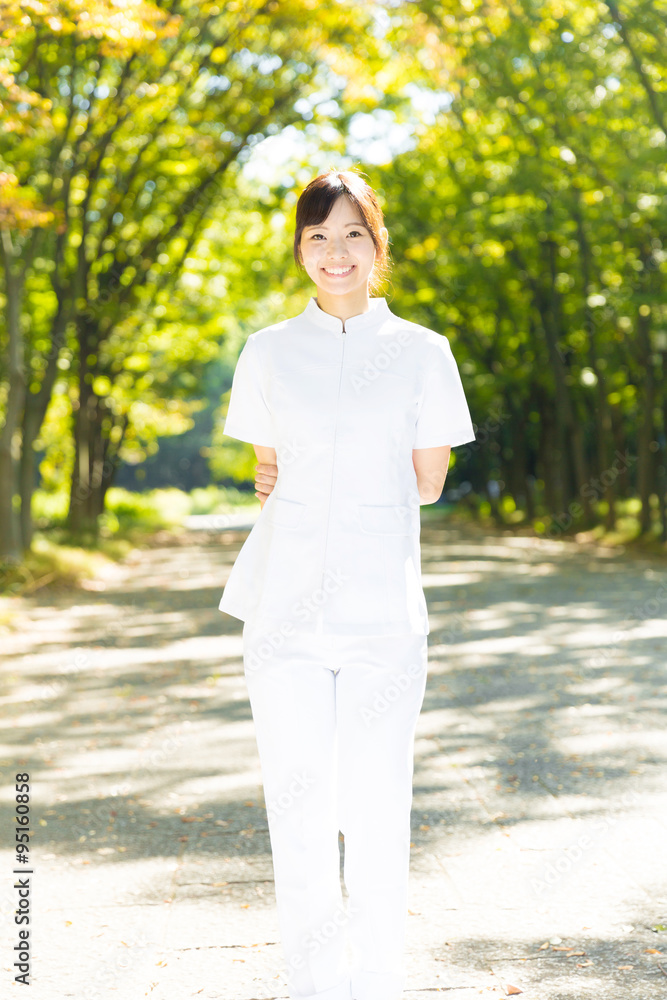 young asian nurse in the park