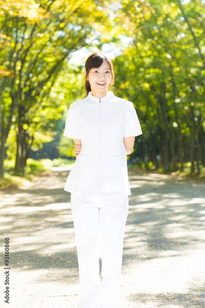 young asian nurse in the park