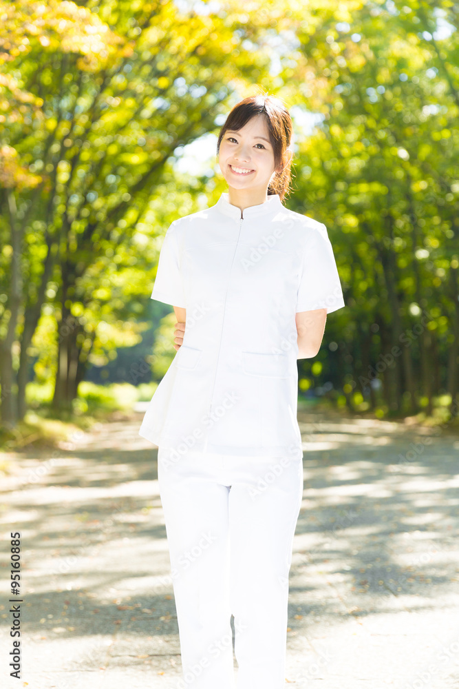 young asian nurse in the park