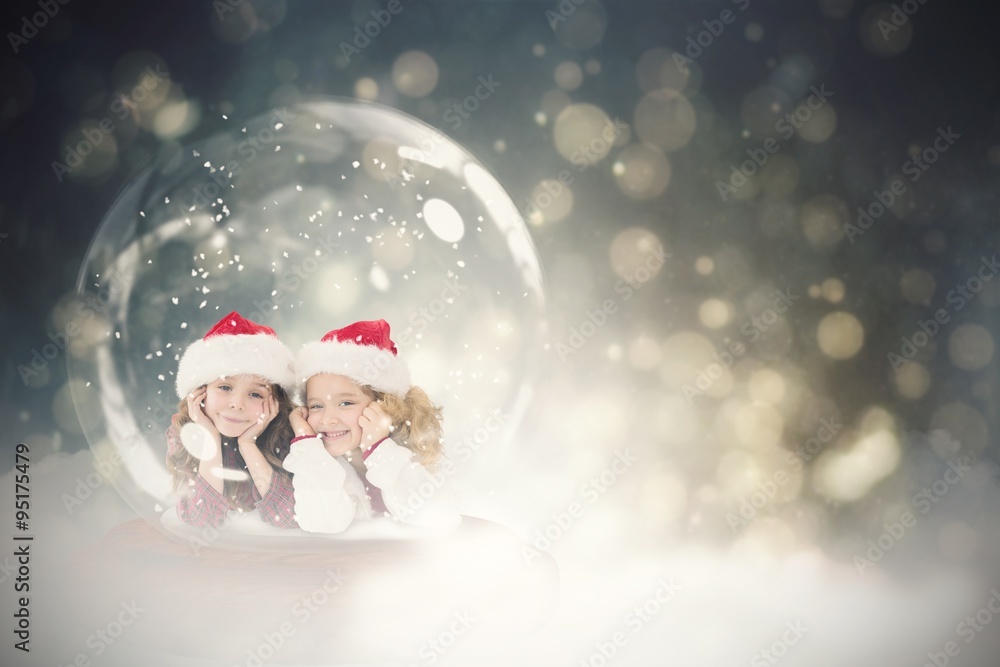 Composite image of festive child in snow globe