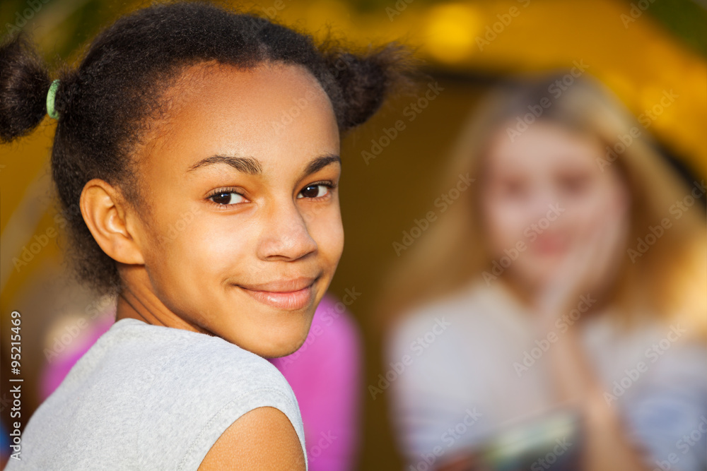 African beautiful girl portrait near yellow tent