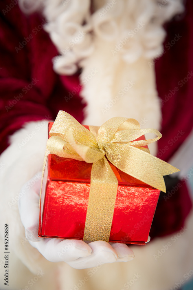 Santa Claus holding gift box