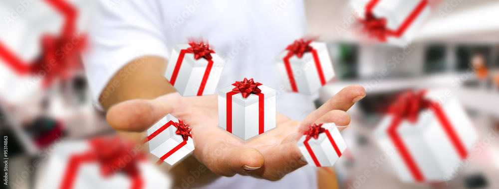 Man celebrating christmas holding gift in his hand