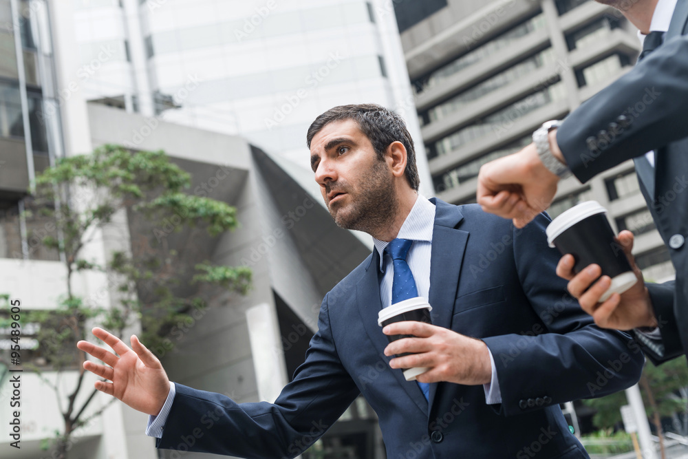 Businessmen catching taxi