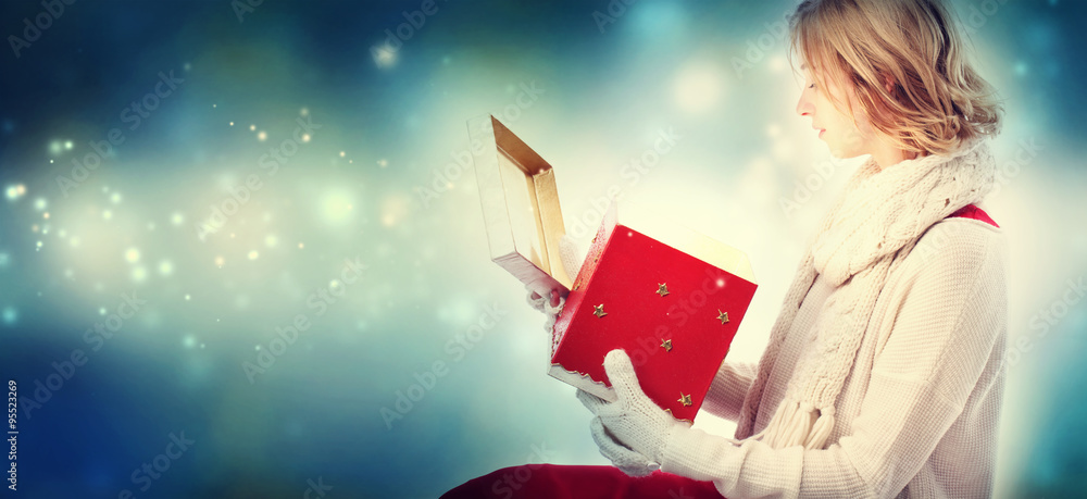 Young woman with Christmas present box